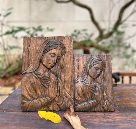 Wood carving of the Virgin Mary in prayer