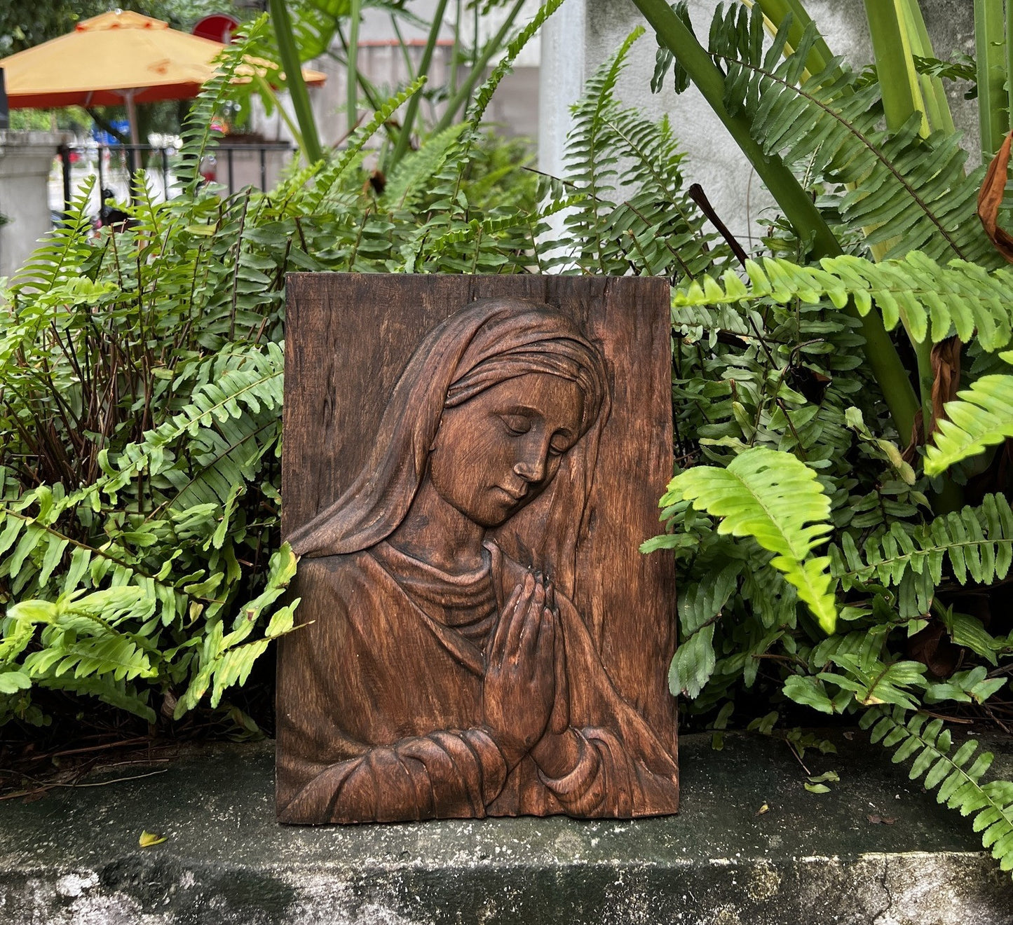 Wood carving of the Virgin Mary in prayer