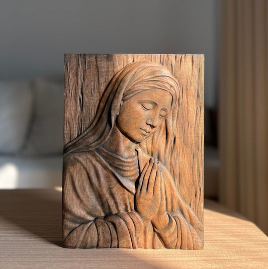Wood carving of the Virgin Mary in prayer
